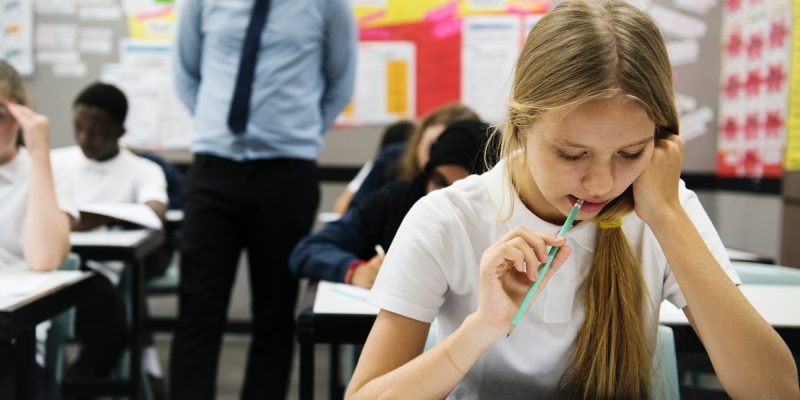 Students doing the exam in classroom